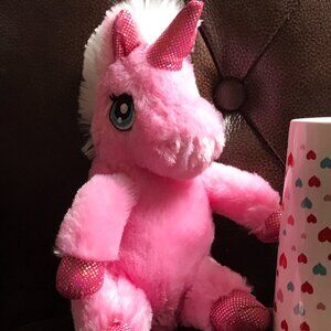 Dan Dees Collectors Choice TM Unicorn in a cup. Pink with white mane and tail.